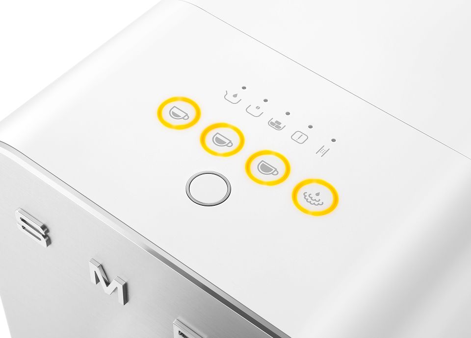 Close-up of Smeg coffee machine control panel with illuminated beverage selection icons on a white surface
