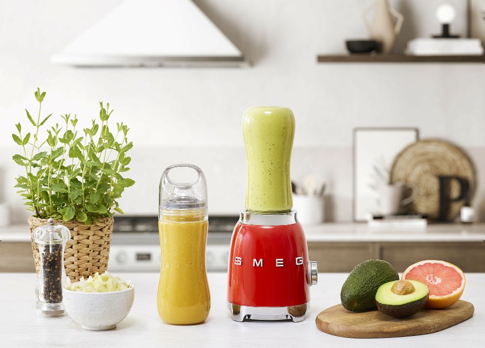 Personal blender includes two bottles
