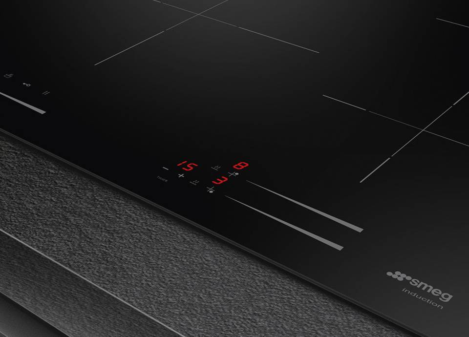 SMEG induction hob with touch controls and illuminated display