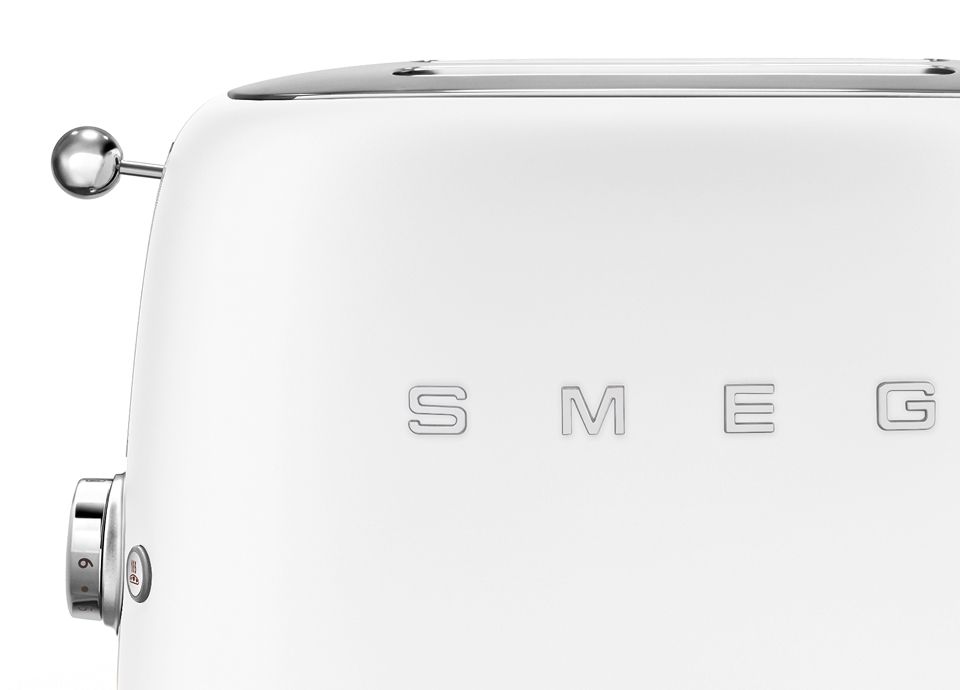 Front and side views of a white matt-finish toaster, showing the chrome control lever, stop button, and Smeg logo.