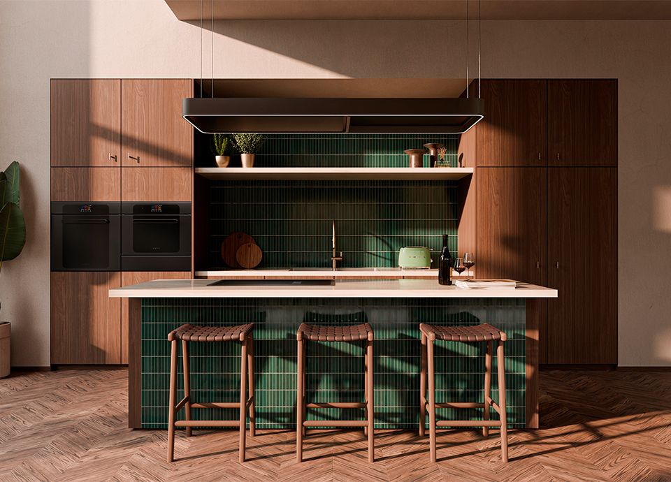 Modern kitchen with wood cabinets, a green tiled backsplash, an island with matching green tiles, and woven bar stools