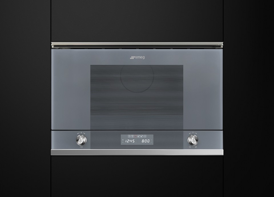 Silver glass built-in microwave with two symmetrical chrome knobs and a central digital LED display.
